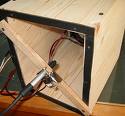 An open loudspeaker box with a fixed ...